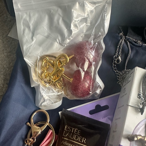 Michael Kors Navy and Cream Striped Tote stuffed with jewelry and skincare - Picture 8 of 10